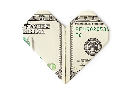 100 dollar bill folded into heart